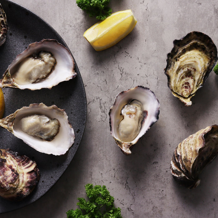 a serving of shucked Coffin Bay Pacific Oysters 